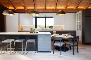 Dramatic waterfall kitchen island in The Avon House, designed by Fusion Designed Interiors.