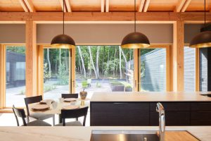 Harmonious connection between indoors and outdoors in The Avon House, fostering a private sanctuary, designed by Fusion Designed Interiors.