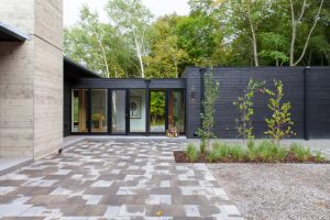 Courtyard with serene views of old-growth forest in The Avon House, designed by Fusion Designed Interiors.