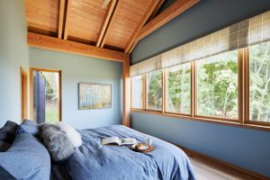 Restored prairie frontage of The Avon House in Avon, MN, blending modernist elements with natural surroundings, by Fusion Designed Interiors.
