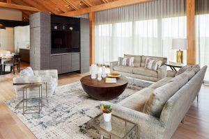 Restored prairie frontage of The Avon House in Avon, MN, blending modernist elements with natural surroundings, by Fusion Designed Interiors.