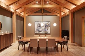 Custom walnut dining table anchoring the main living space in The Avon House, crafted by Fusion Designed Interiors.