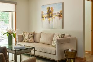 Living area in Stillwater, MN condo, designed by Fusion Designed Interiors with sustainable furnishings.