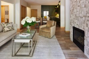 Modern condo living room in Stillwater, MN, designed by Fusion Designed Interiors, featuring sustainable materials and biophilic design elements.