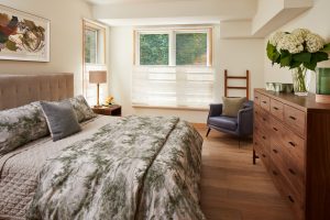 Serene bedroom in Stillwater, MN condo, featuring minimalist design by Fusion Designed Interiors.
