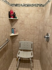 Eco-friendly bathroom design emphasizing holistic and sustainable elements by Fusion Designed Interiors.